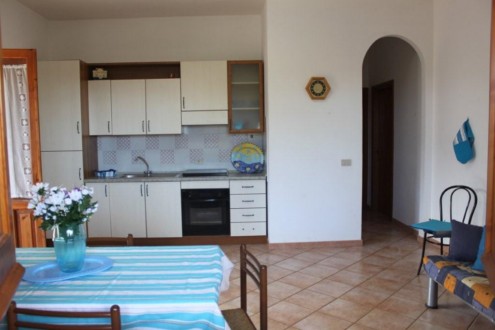  THE LIVING ROOM AND THE KITCHEN